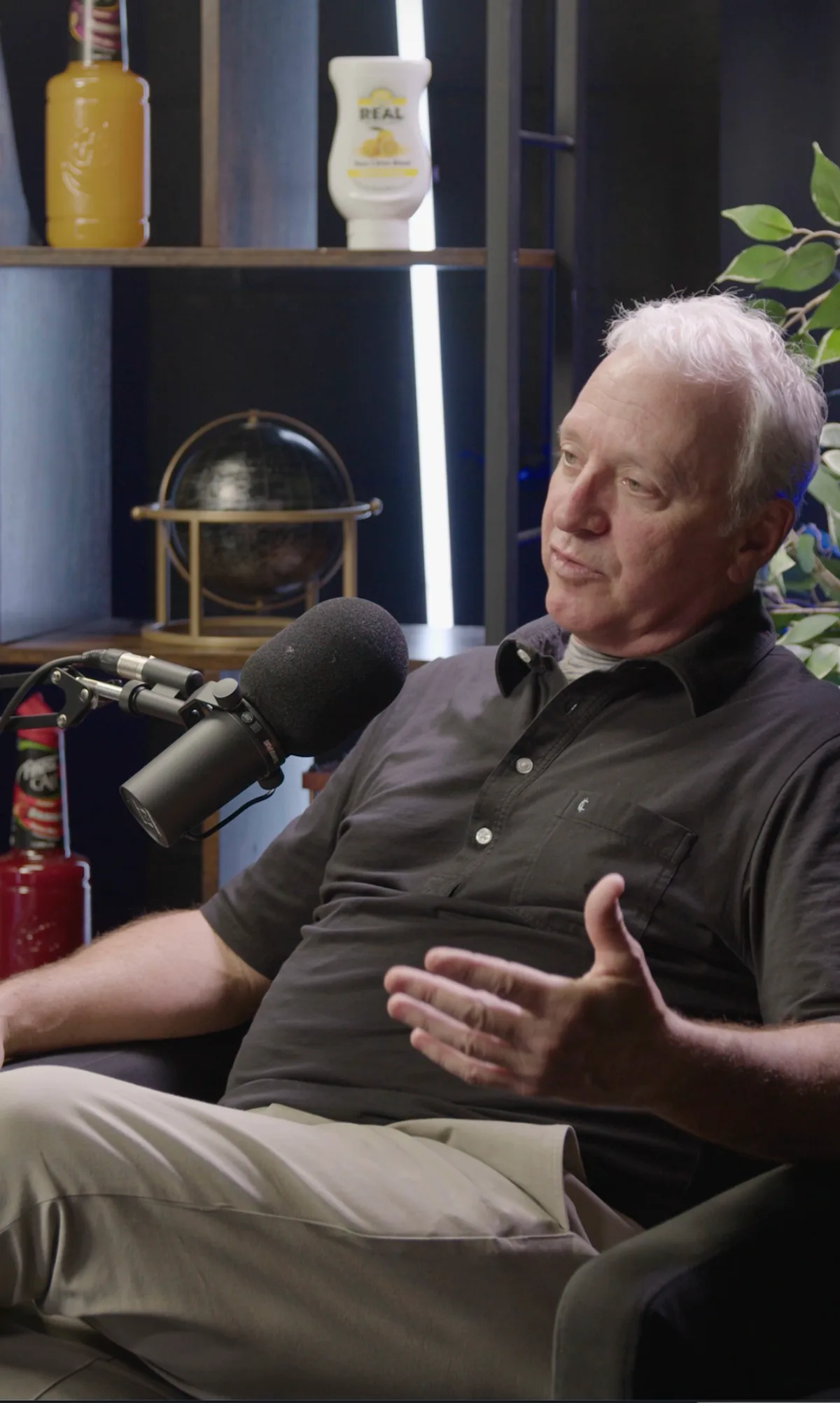A guest recording in the studio, mid-conversation